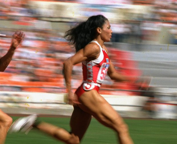 Image of woman racing to the finish line